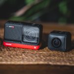 black and red camera on brown surface